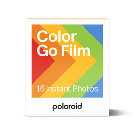 Close-up of glossy white Polaroid Go frames on color film.