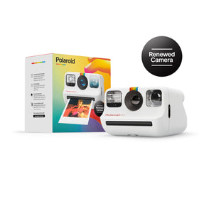 Polaroid Go beside a smartphone for scale, demonstrating pocket-sized design — Polaroid travel-friendly