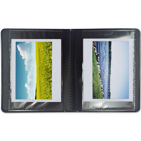 Polaroid film and album on table lifestyle scene showing gifting appeal