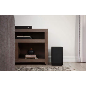 Polk Audio React subwoofer mounted in a home theater setup for cinematic bass