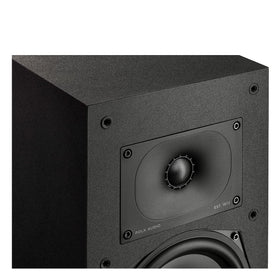 Polk Monitor XT20 pair shown in a modern living room setup.