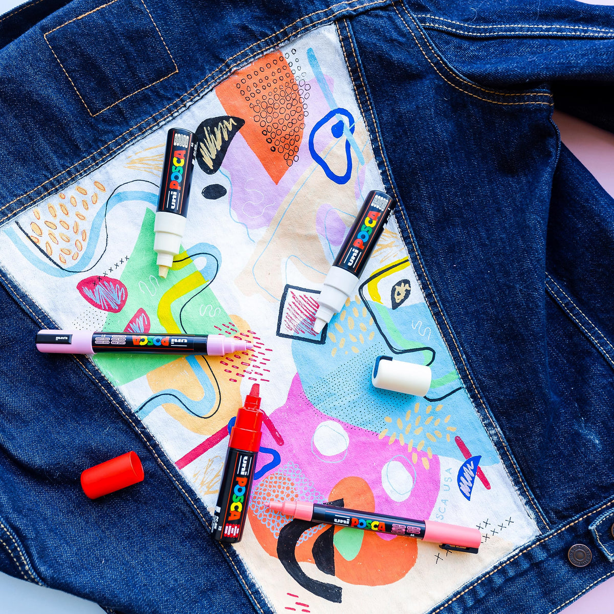 Posca 1MR on fabric for vibrant apparel embellishment.