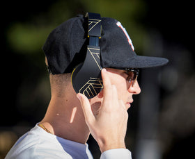 PowerLocus worn by commuter for comfortable on-the-go audio
