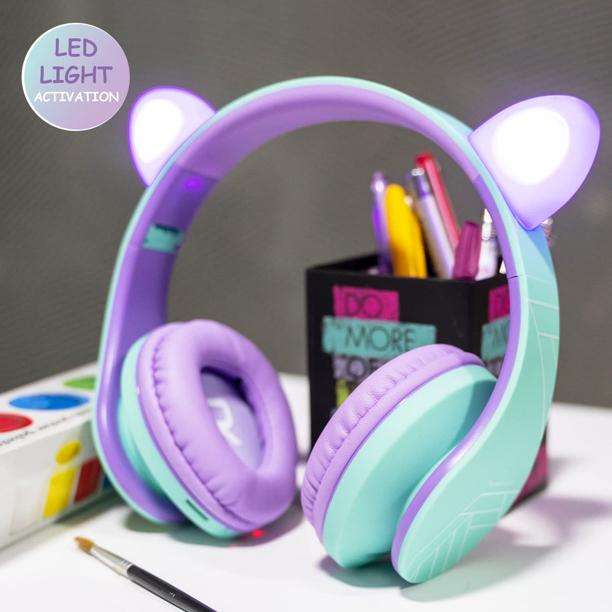Kids wearing PowerLocus P2 headphones for comfortable listening during study.