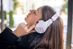 PowerLocus next to smartphone showing size and real-world scale