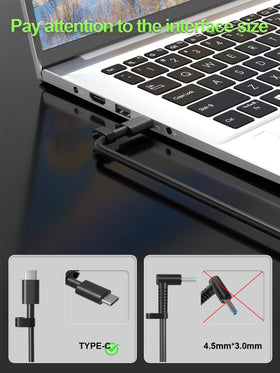 PowerPortnerLink 65W USB-C charger beside Dell XPS for desk use.