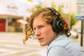 Thick ear cushions enhance comfort and passive isolation for long sessions.