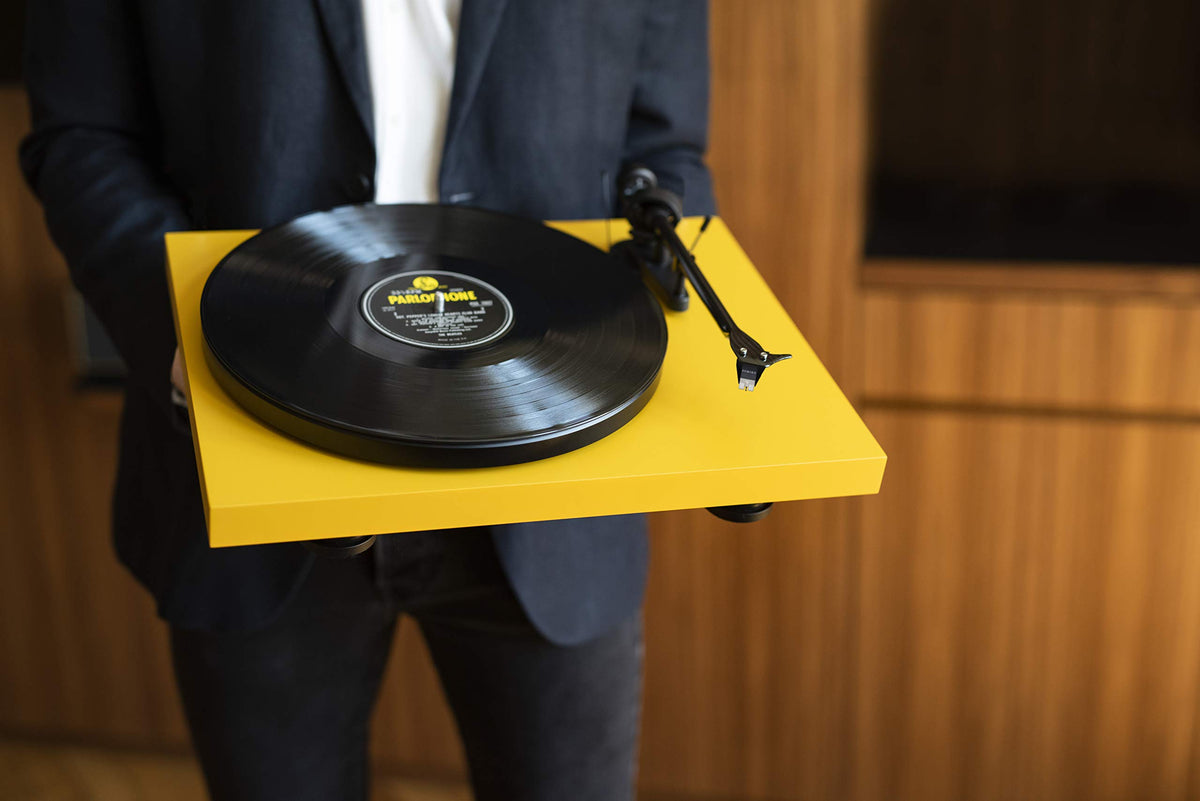 Pro-Ject Debut Carbon EVO in a welcoming room setup showing lifestyle use.