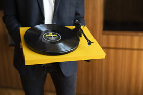 Pro-Ject Debut Carbon EVO in a welcoming room setup showing lifestyle use.