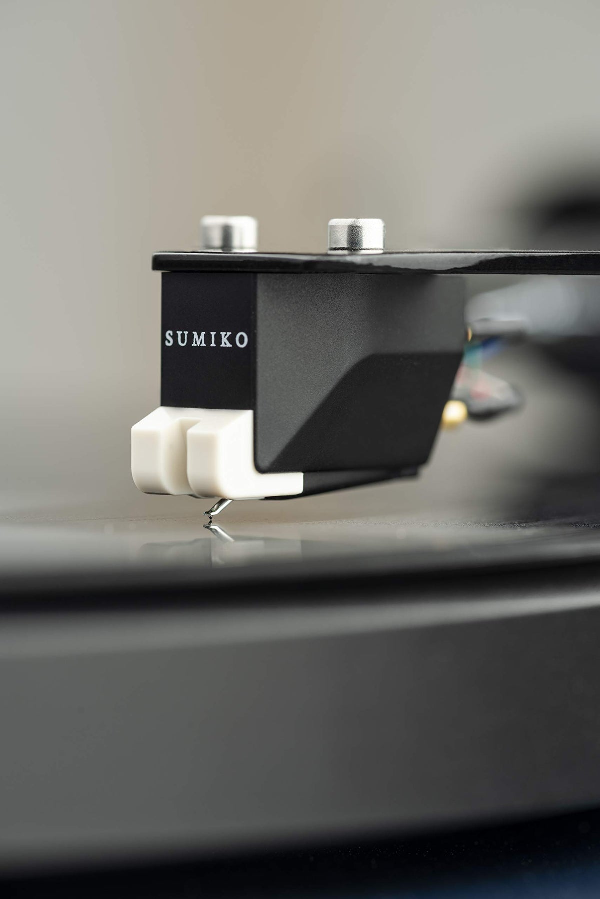 Pro-Ject Debut Carbon EVO tonearm carbon fiber close-up highlighting precision.