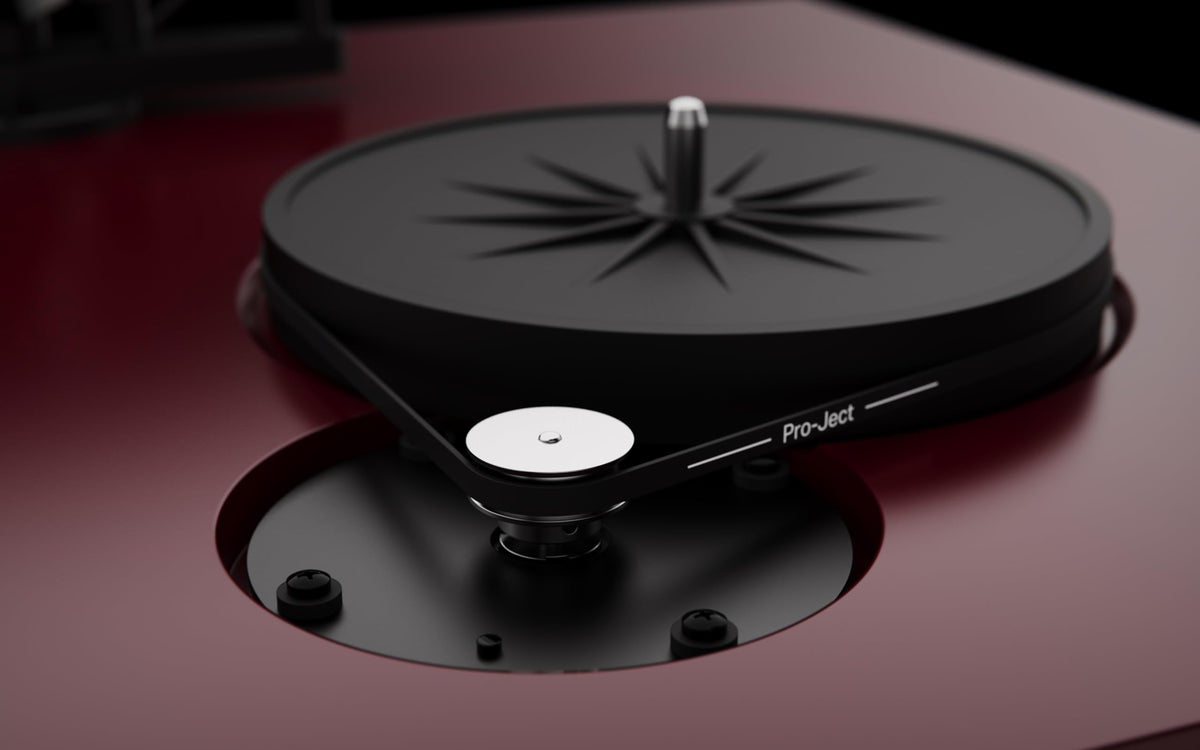 Pro-Ject Debut EVO 2 gloss white finish in a modern room.