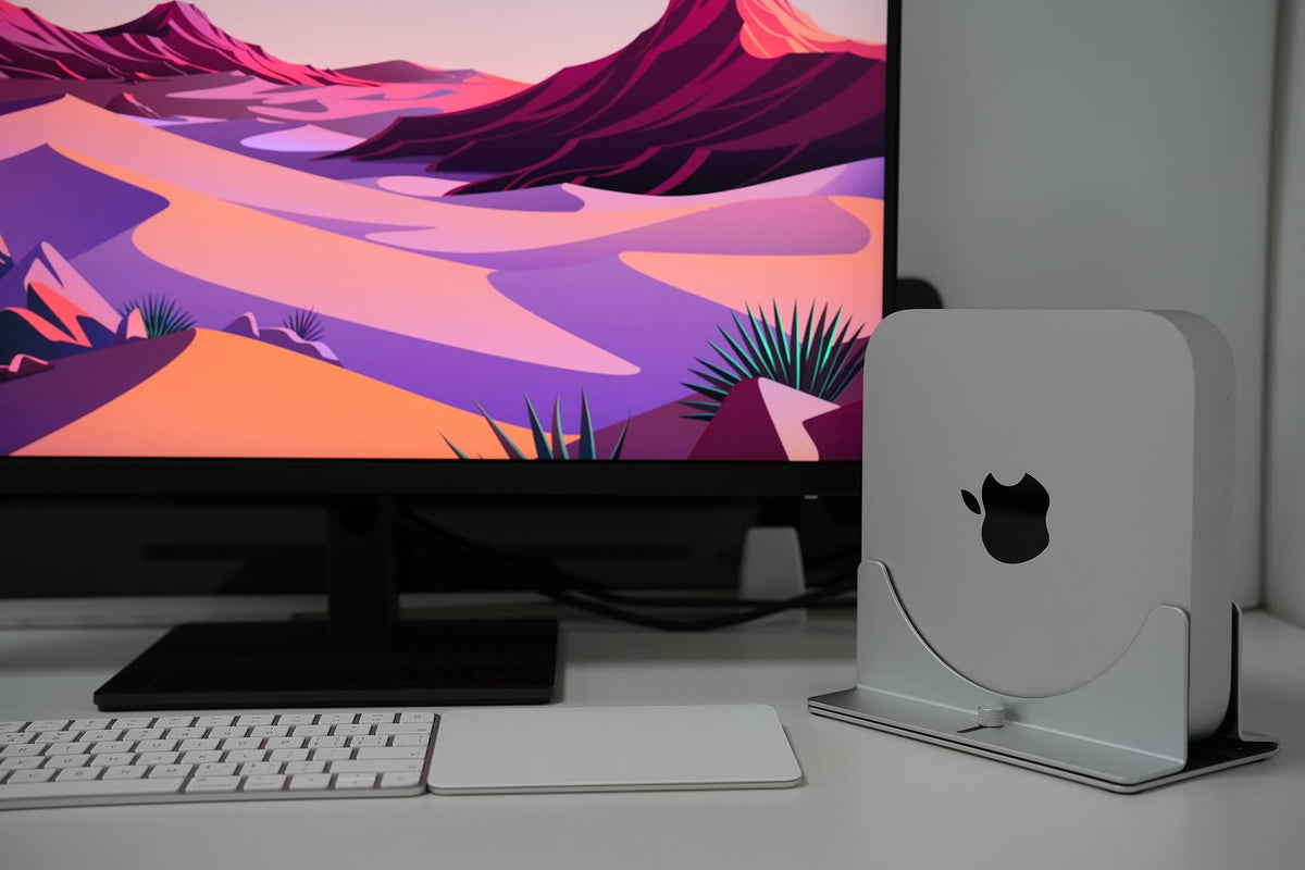 Psitek Mac Mini Stand elevated setup improves airflow and desk organization.