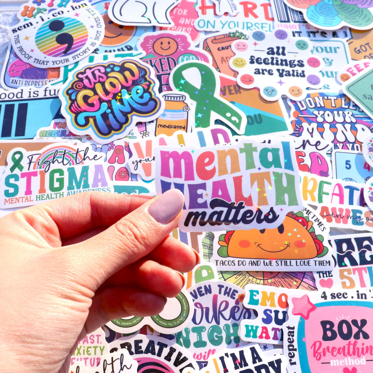 Puraesla stickers on journal enhance mindful journaling with uplifting visuals.