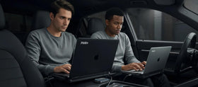 PWR+ lifestyle image with laptop on car seat for on-the-road productivity