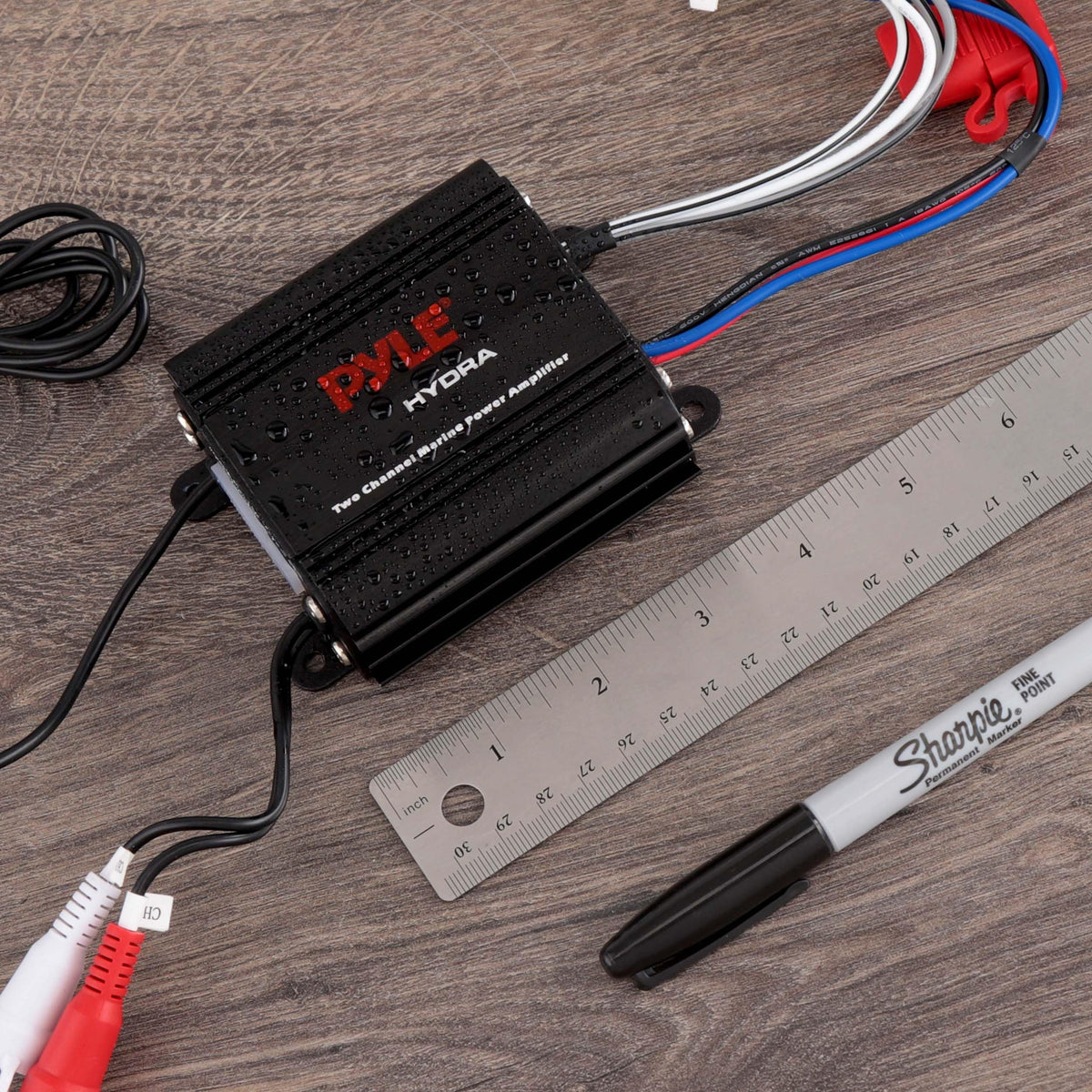 Pyle amplifier installed on boat bulkhead demonstrating weatherproof audio upgrade benefit