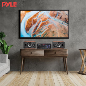 Pyle amplifier next to a ruler for scale showing compact footprint