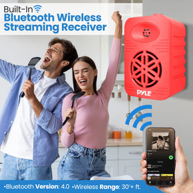 Pyle PDWRBT46RD waterproof outdoor speakers on a patio setting.