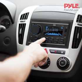 Pyle PLR2DN next to a coin to show double-DIN size for planning dash fitment