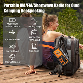 QAUYYW placed next to a hand to show compact size and portability