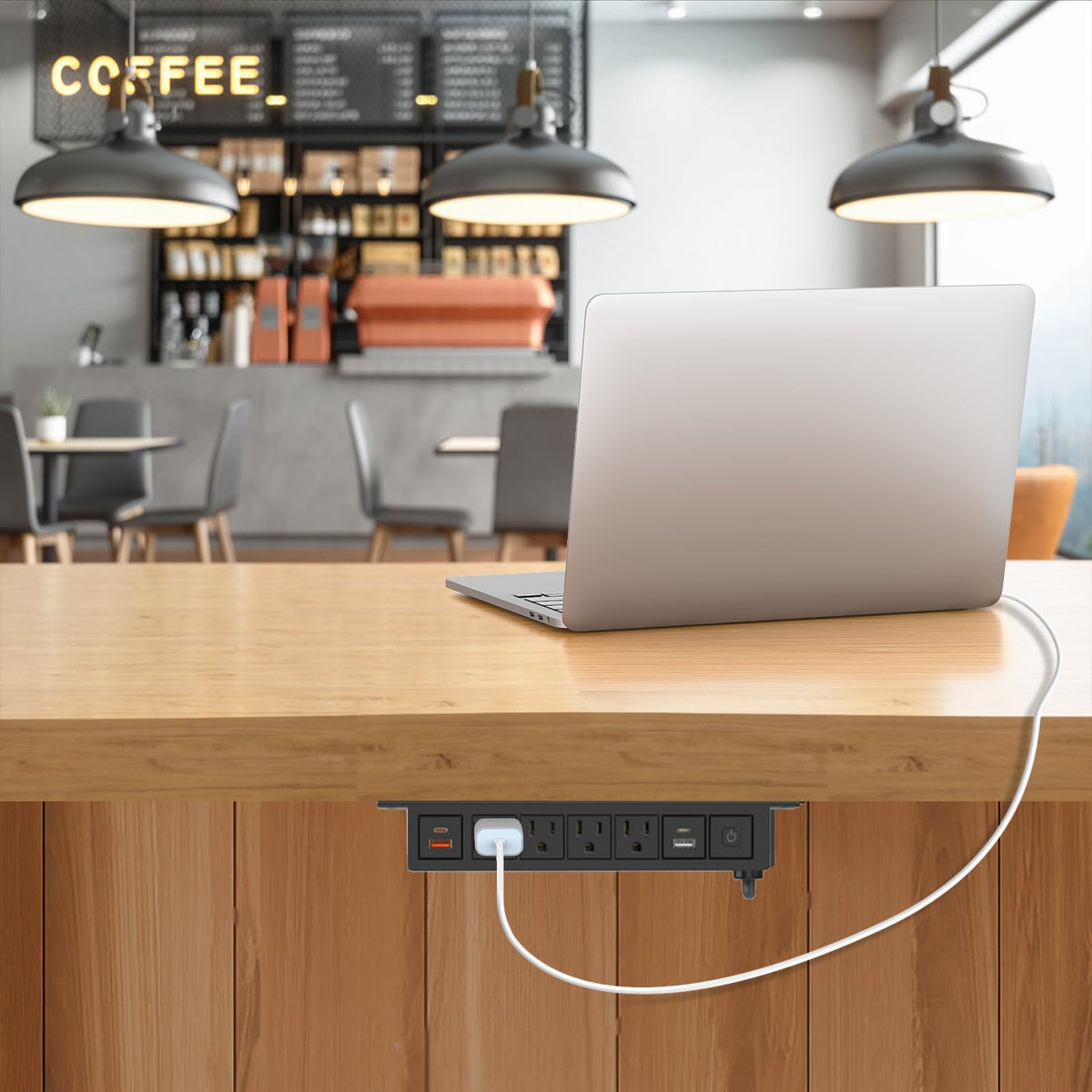 QBA powering phone and laptop demonstrating simultaneous device charging convenience
