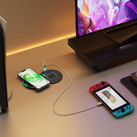 QBA on nightstand charging phone wirelessly demonstrating clutter-free convenience