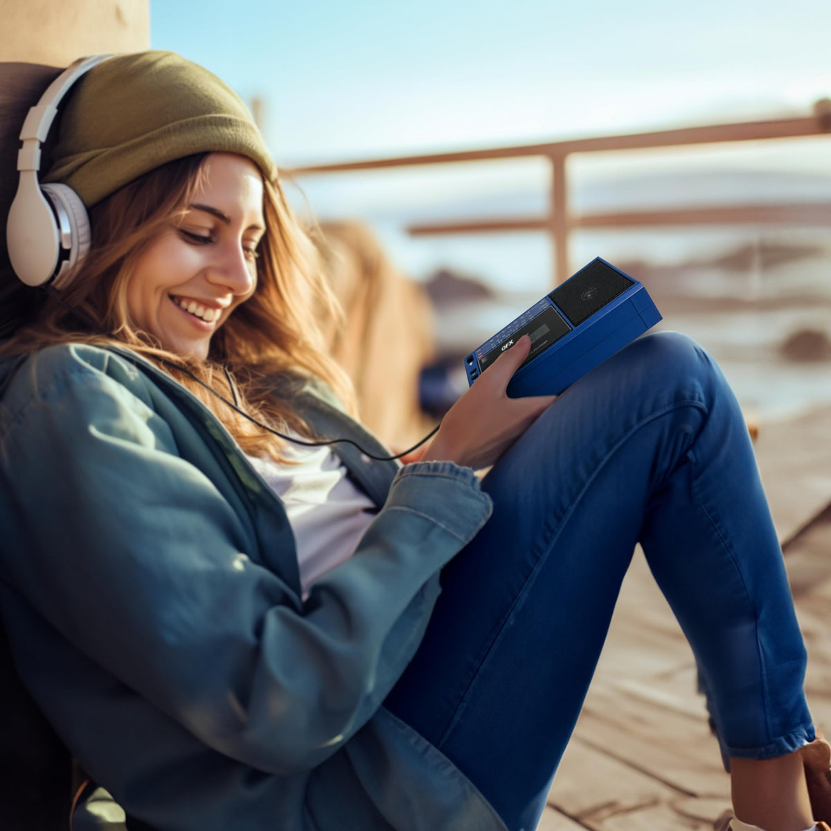 QFX boombox in use outdoors with person enjoying music and portable convenience