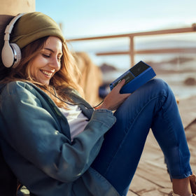 QFX boombox in use outdoors with person enjoying music and portable convenience