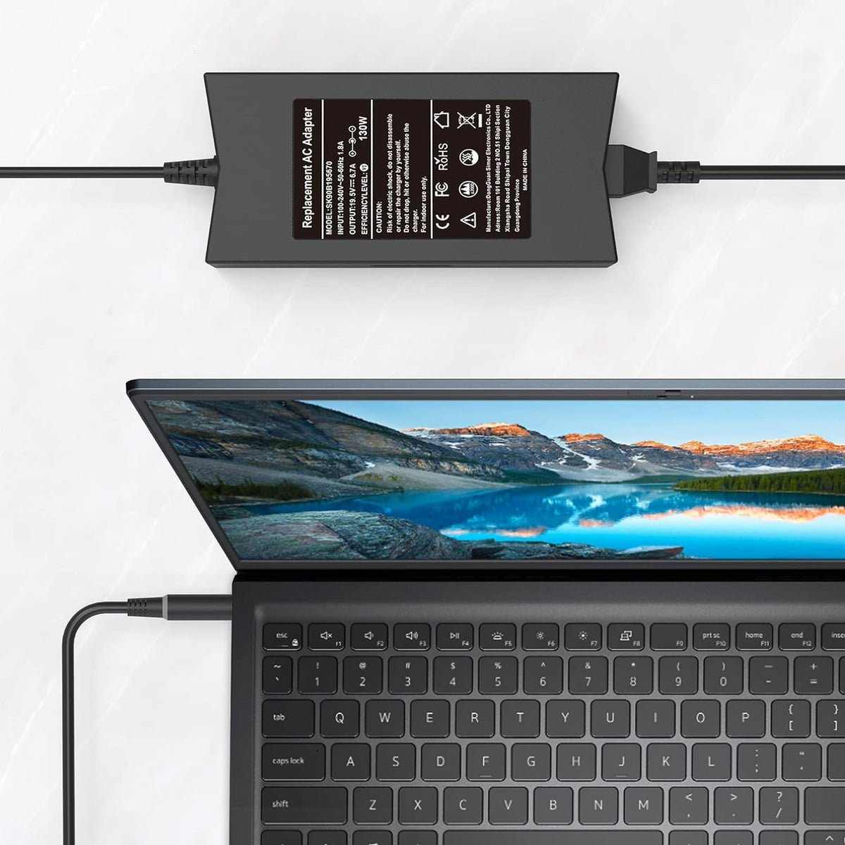 QIOUZW in use on a Dell Inspiron demonstrates reliable charging performance