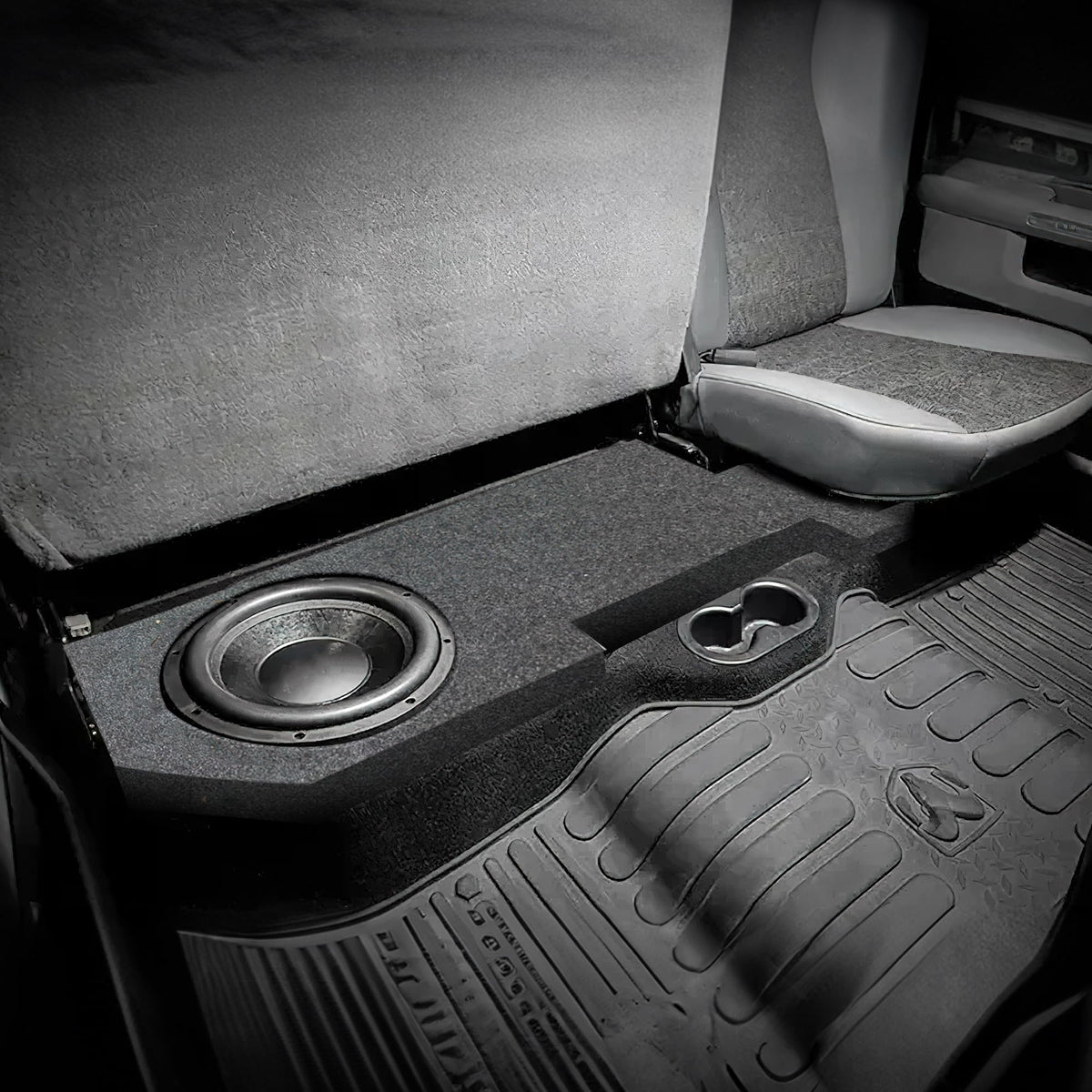 QPower underseat subwoofer charcoal carpet detail indicating durable finish