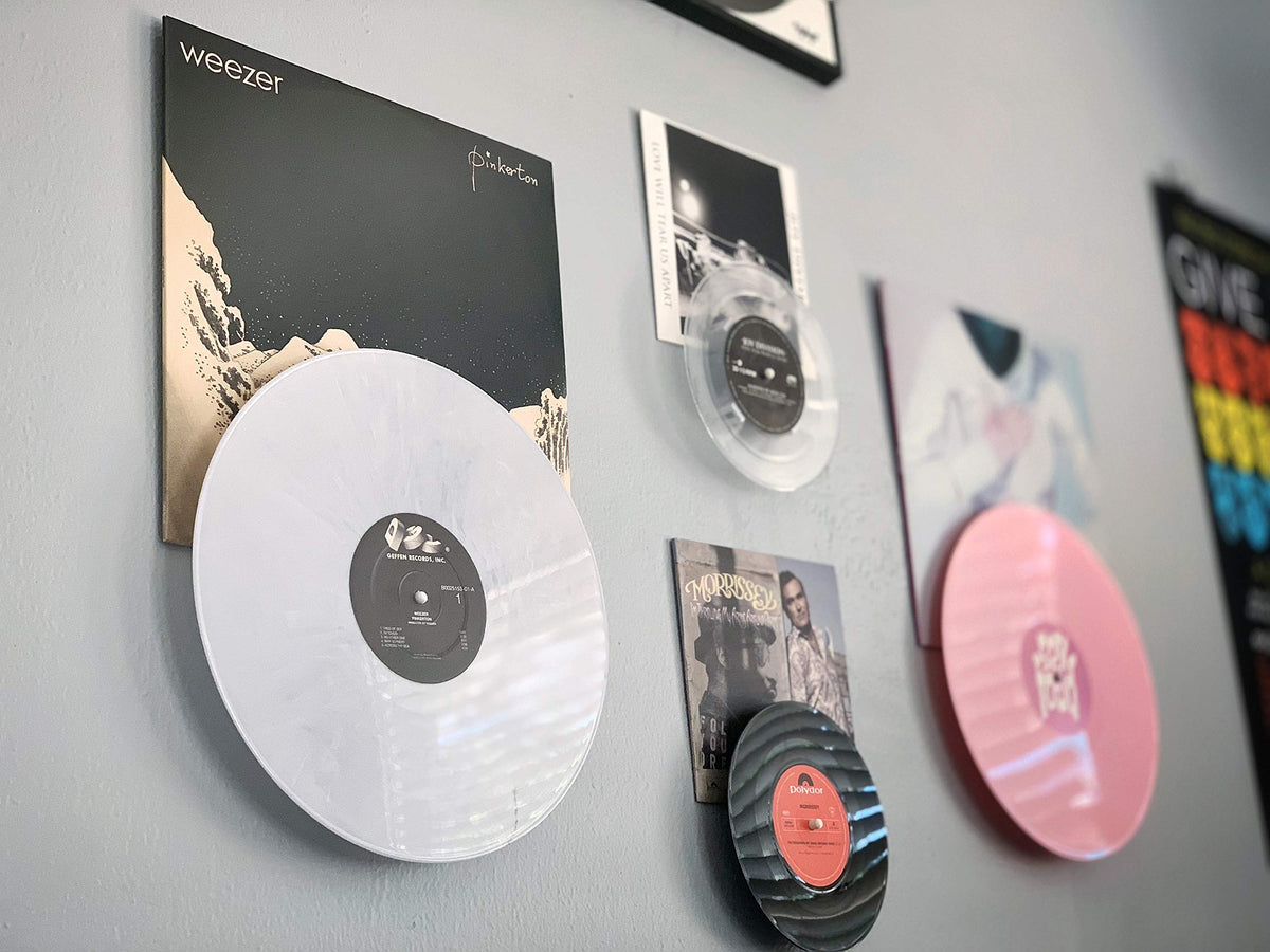 Record Props wall display with album cover for now playing decor.