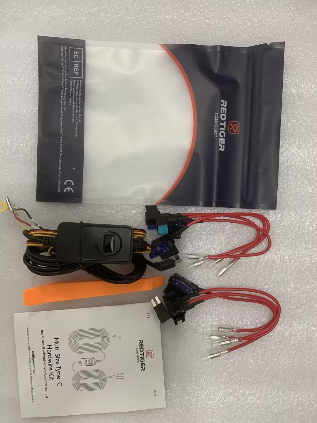 REDTIGER kit next to ruler for scale to show compact size and installation convenience