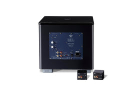REL Acoustics HT-Air MKII elegant cube design complements modern audio racks.