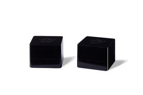 REL Acoustics HT-Air MKII transmitter in a compact cube design enabling wireless subwoofer placement.