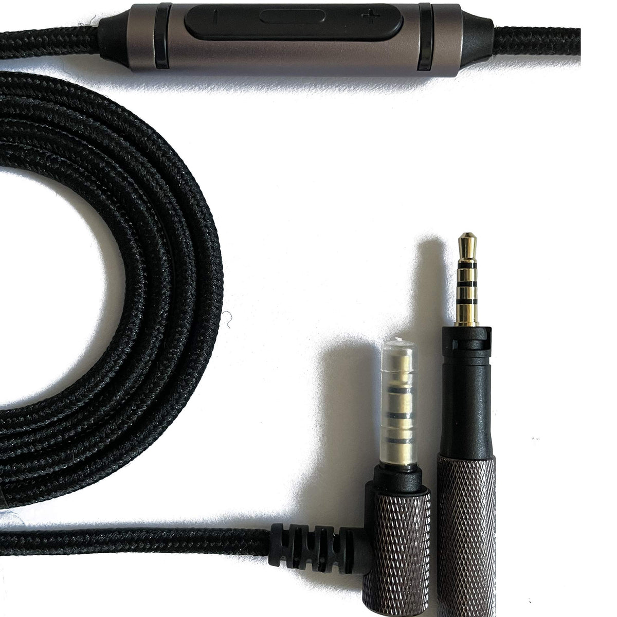 renensin cable coiled next to headphone case showing compact storage convenience