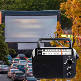 Retekess TR604 held in hand for scale showing compact, portable design