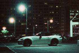 RETO evening street scene shot demonstrating warm color and low‑light performance