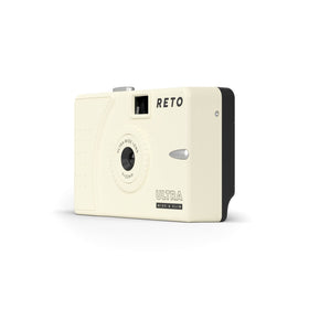 RETO compact in hand demonstrates its pocket-friendly, light design for everyday photography.