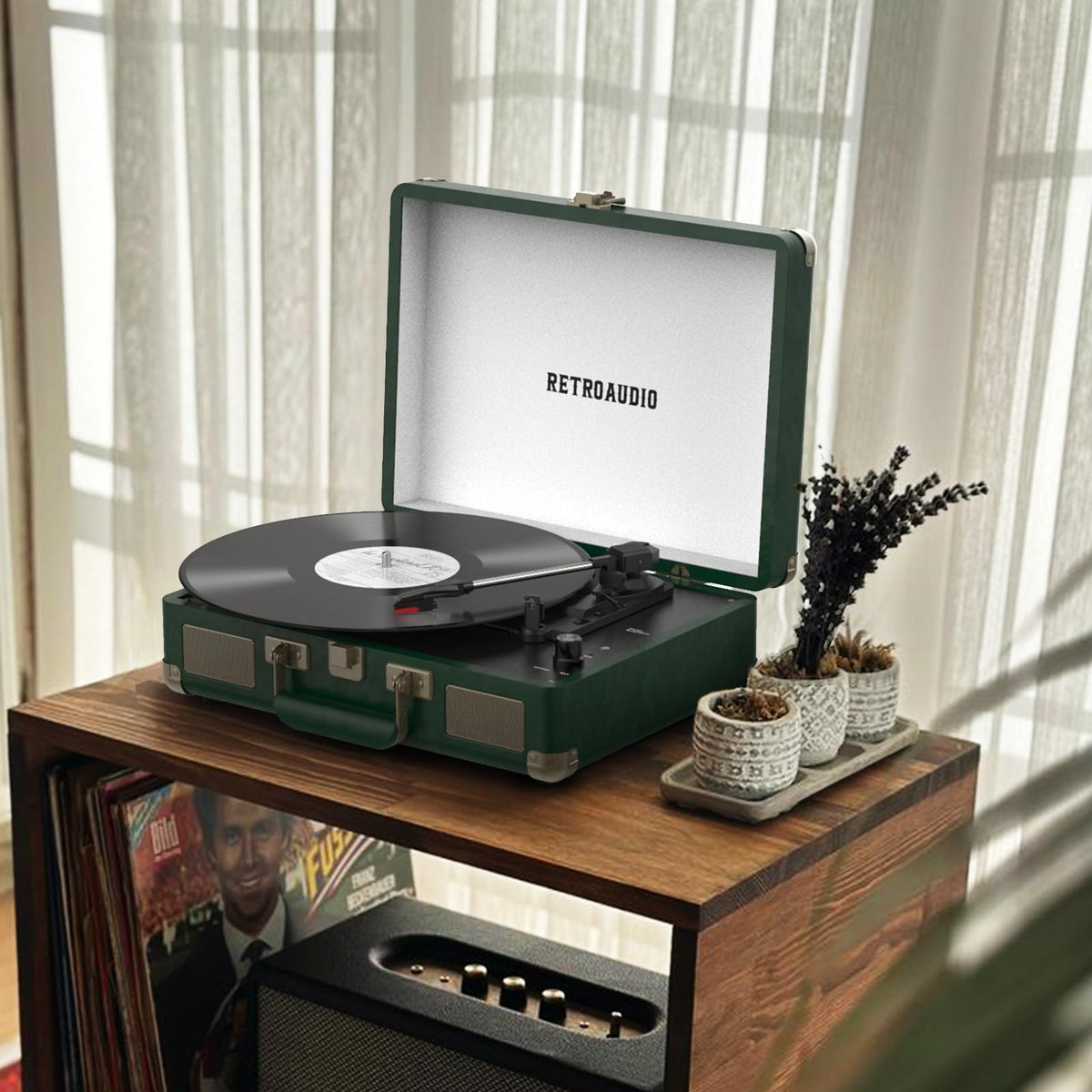 RetroAudio held by hand to show compact suitcase scale and easy transport