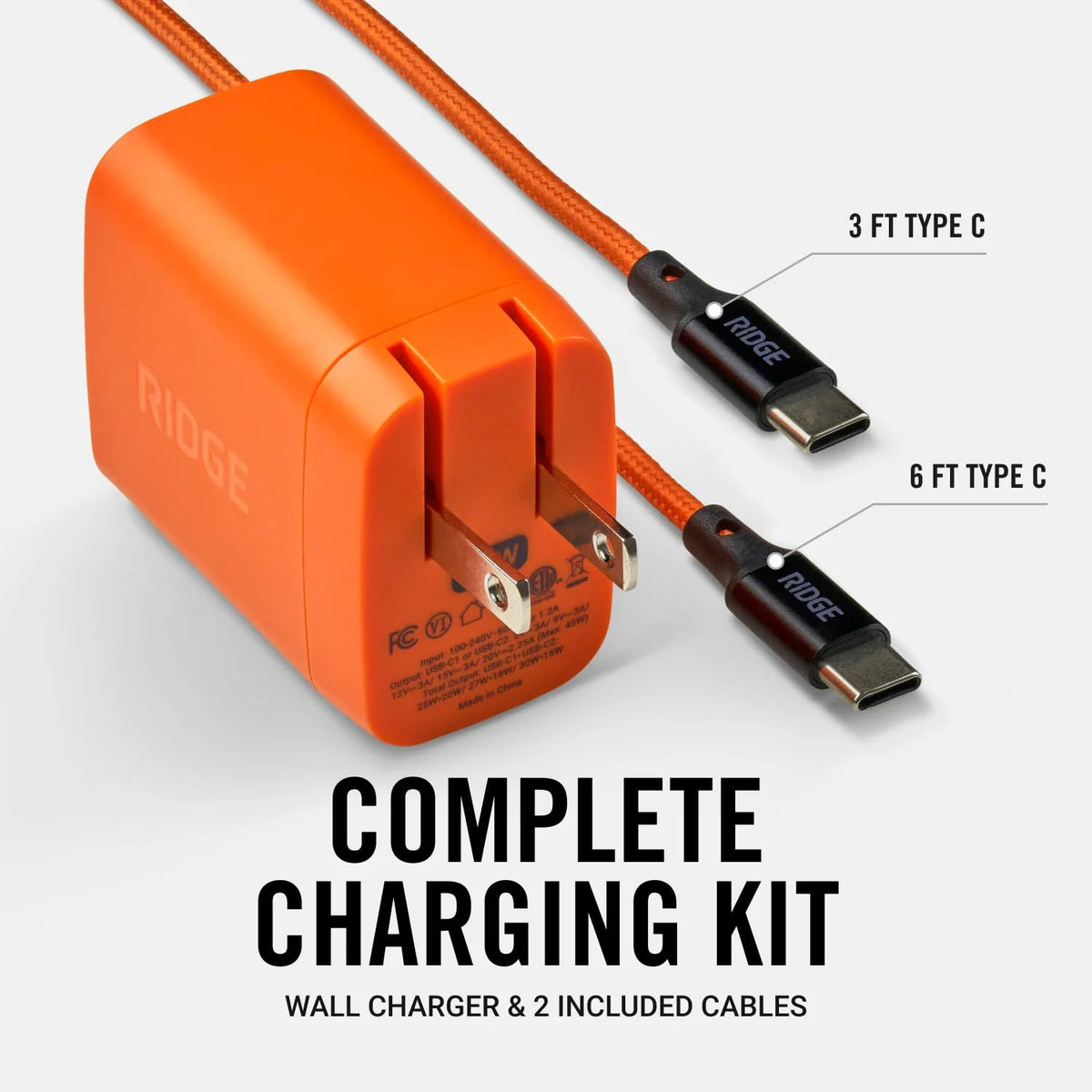 The Ridge adapter charging a laptop and phone simultaneously, saving outlet space