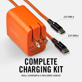 The Ridge adapter charging a laptop and phone simultaneously, saving outlet space