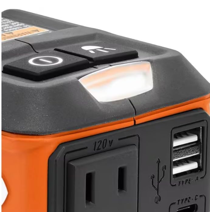 RIDGID inverter on a jobsite powering devices with toolbag and workbench background