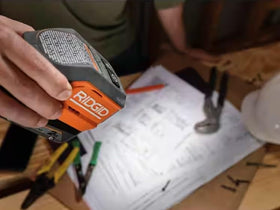 RIDGID inverter held in hand to show compact size and easy transportability