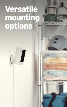 Ring Indoor Cam placed in a living room, showing monitoring in a home setting, benefits peace of mind