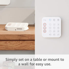 Ring keypad with box next to common household items to show size and portability