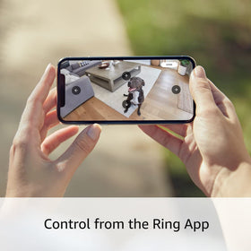 Ring pan-tilt mount held in hand to show compact size and easy installation for homeowners