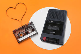 Riptunes beside USB and cassette showing compact size and portability