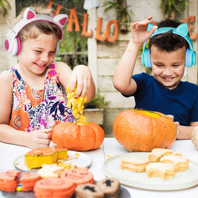 Child wearing Riwbox CT-7S watching a tablet, comfortable and safe listening