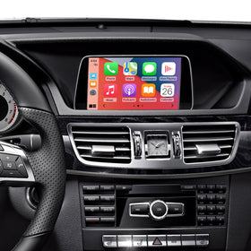 Road Top wireless CarPlay kit connected to a Mercedes E-Class dashboard for seamless integration.