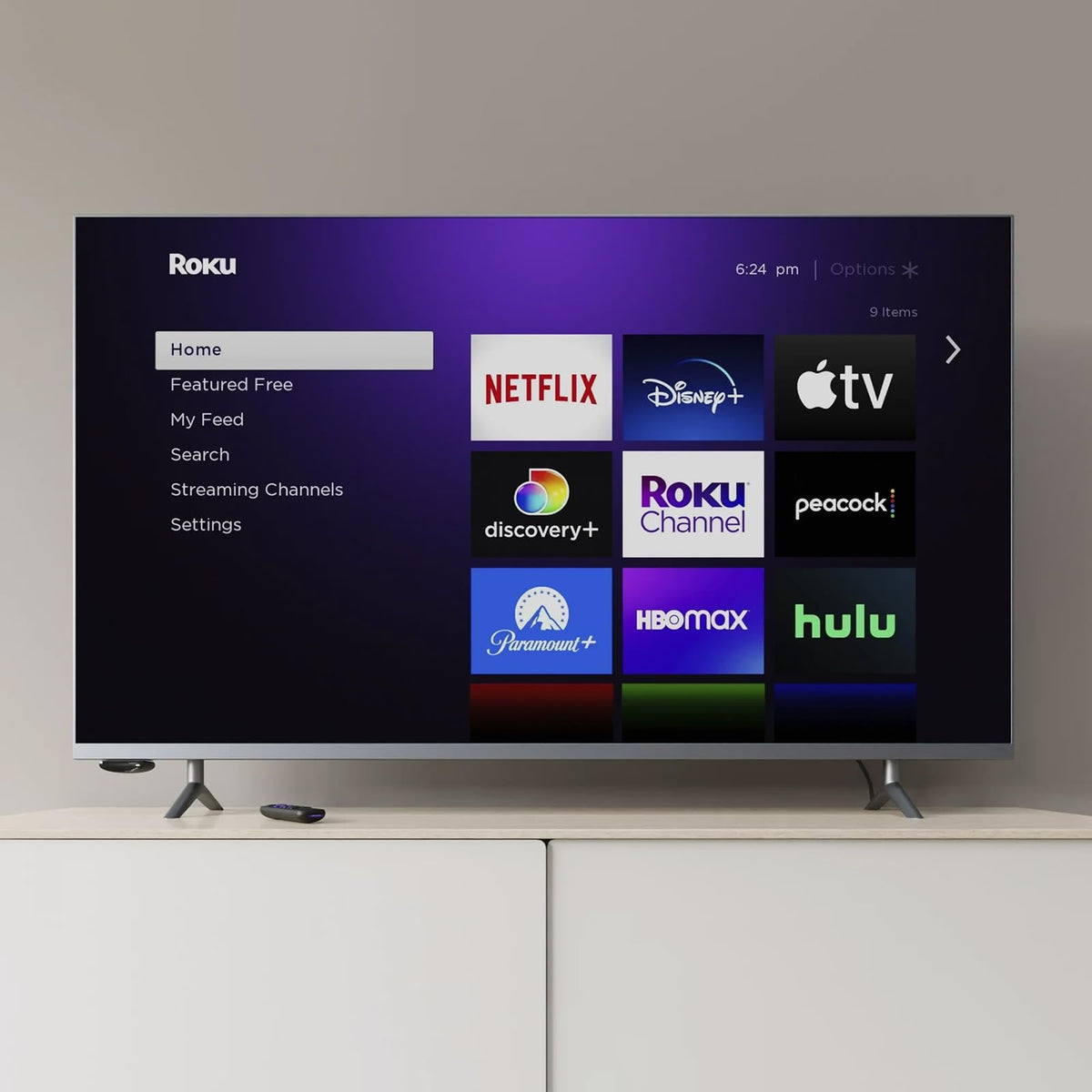 Family watching TV with Roku Express 4K+ showing vivid 4K picture and simple navigation