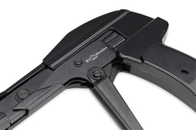 RV Rhodes zip tie gun next to pliers to show compact scale and jobsite portability
